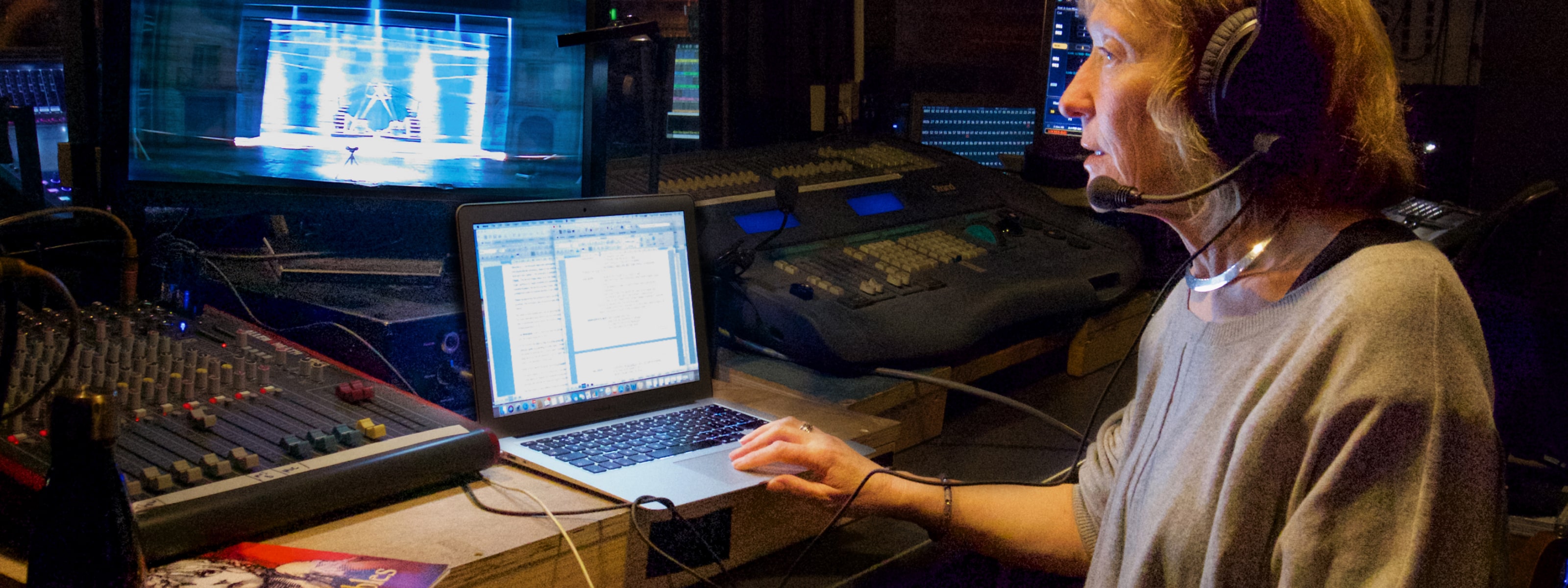 Anne Hornsby of Mind's Eye, backstage providing audio description for a theatre performance