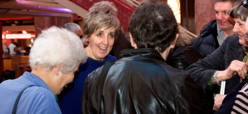 Julie Hesmondhalgh chatting to audio description attenders at a performance of Mother Courage at the Royal Exchange Theatre