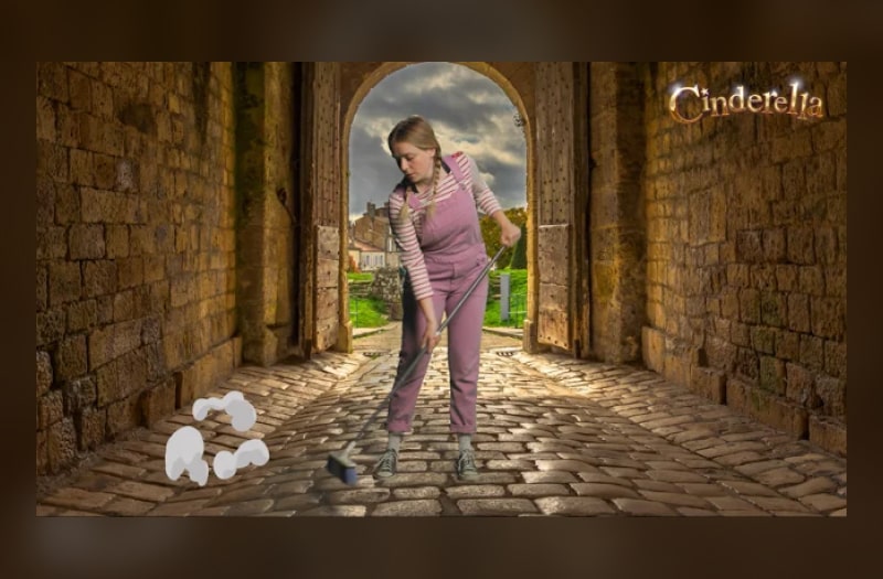 The image is a near-photographic illustration of a teenage girl in faded pink dungarees and stripy pink and white top. She has blonde pigtails. She is sweeping the cobblestones of a castle gateway, the gates open to a landscape behind her.