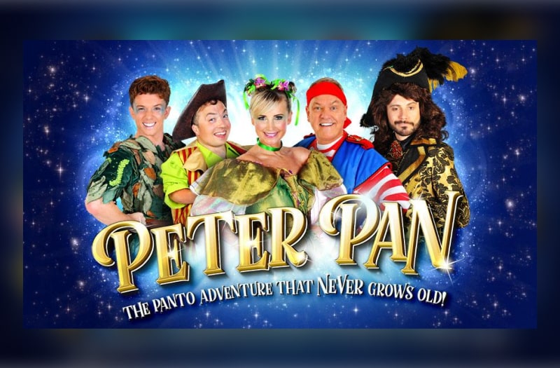 The image for Peter Pan shows the cast in costume against a starry blue background. Under is the title in gold with the strapline The Panto Adventure That Never Grows Old.