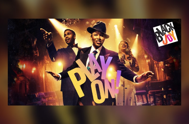 The image is set in Harlem’s Cotton Club. Against the background of a brightly lit stage are three performers. A young man on the left in evening dress points as though out to the audience. A young woman on the right sings to a vintage microphone, eyes closed in bliss. In the centre is a woman wearing a man’s suit and hat, her eyes shining, arms extended.